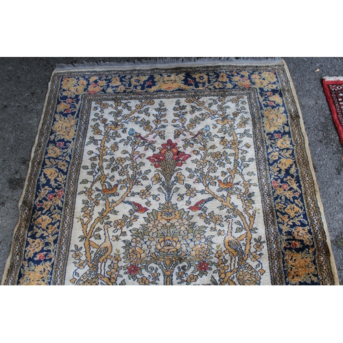 14 - Wool machine made rug in Persian pattern, decorated with birds and flowers on a beige ground, 172 x ... 