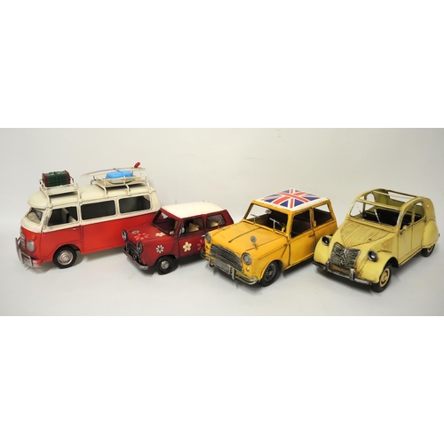 140 - Four modern metal ornamental vehicles of VW Camper, Mini, 2CV etc.