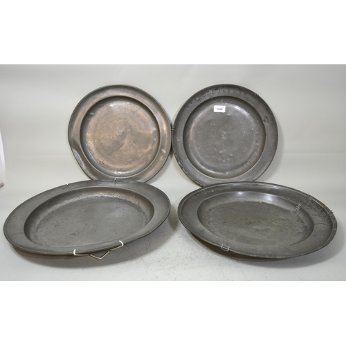 1424 - Group of four large antique pewter chargers, 42cm diameter