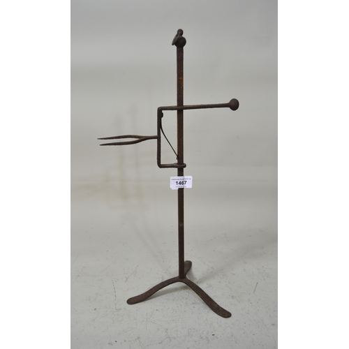 1467 - Antique wrought iron lark spit on a tripod base, 47cm high