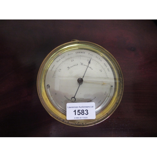 1583 - Dent, circular brass cased aneroid barometer with silvered dial, 12cm diameter