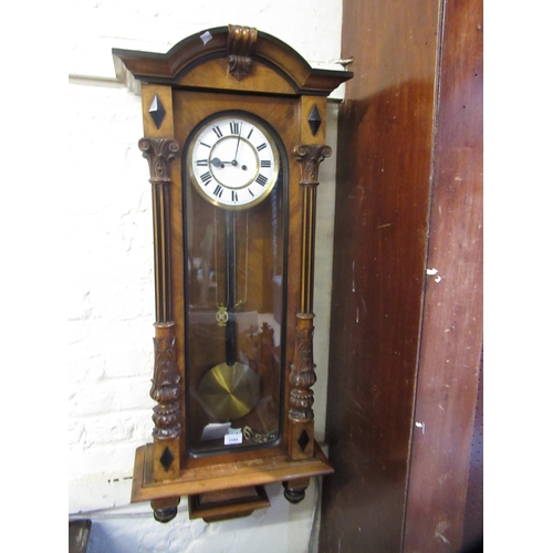 1584 - Late 19th Century walnut Vienna wall clock, the enamel dial with Roman numerals, the two train weigh... 