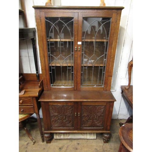 1649 - Carved oak bookcase, having leaded glazed doors (associated top), 95cm wide x 48cm deep x 180cm high