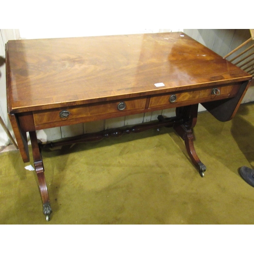 1651 - 19th Century mahogany and yew wood crossbanded drop-leaf sofa table, with two drawers having circula... 