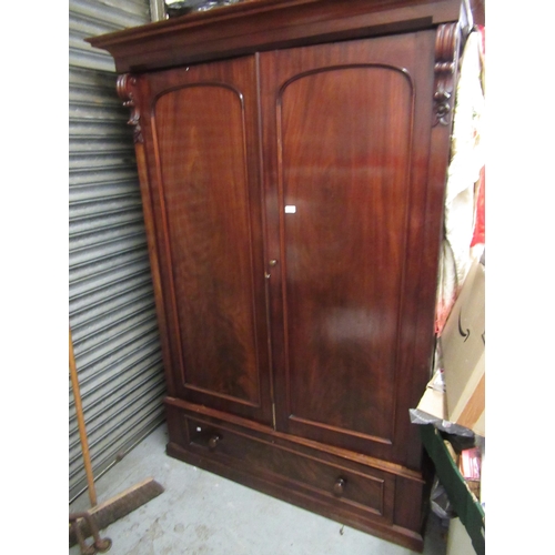 1656 - Victorian mahogany wardrobe with a moulded cornice above two arched panelled doors with drawer below... 