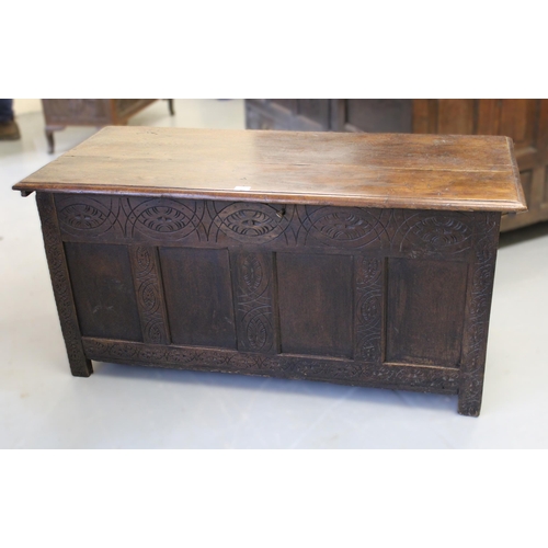 1664 - 18th Century oak four panel coffer with carved decoration on stile end supports, 133cm x 59cm x 63cm... 