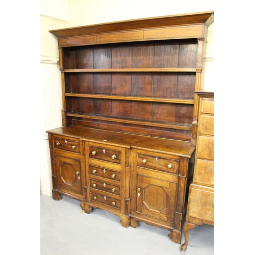 1689 - Early 19th Century elm and mahogany dresser, the boarded shelf back above a breakfront with moulded ... 