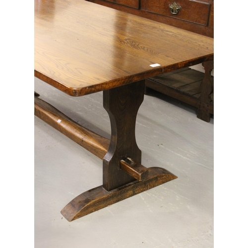 1690 - Reproduction oak refectory style dining table on slab end supports, 214 x 88cm, together with a matc... 