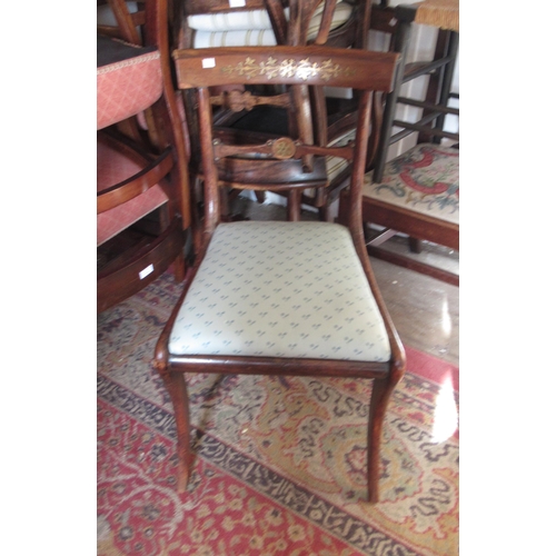 1805 - Set of six Regency simulated rosewood and cut brass inlaid dining chairs with rail backs and sabre s... 