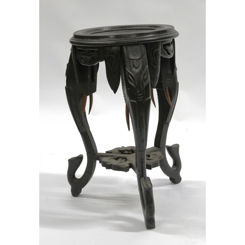 1806 - Indian ebonised jardiniere stand on elephant supports, 60cm high