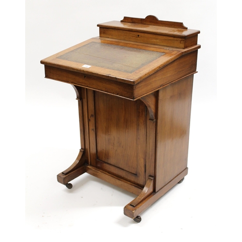 1846 - Late Victorian walnut Davenport with a stationery compartment and sloping top above a front panel do... 