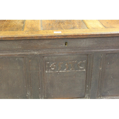 1854 - 18th Century oak coffer, with a three panelled top and front raised on stile feet, 121cm x 60 cm x 7... 