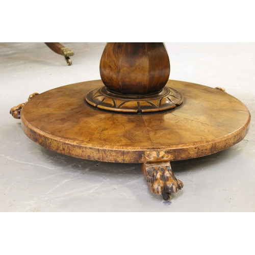 1855 - Victorian circular walnut tilt top centre table, on baluster column and circular platform base with ... 