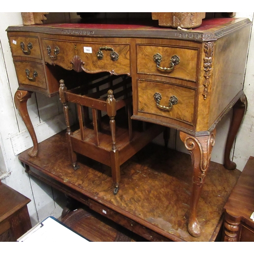 1862 - Mid 20th Century walnut writing table with a red leather inset top above five drawers, raised on cab... 