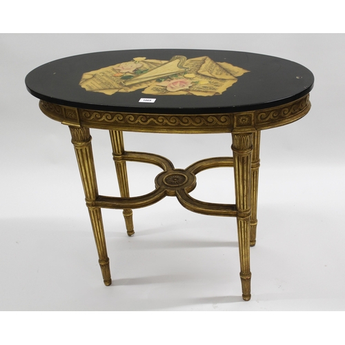 1869 - Reproduction oval giltwood occasional table with a polished black slate top decorated with musical s... 