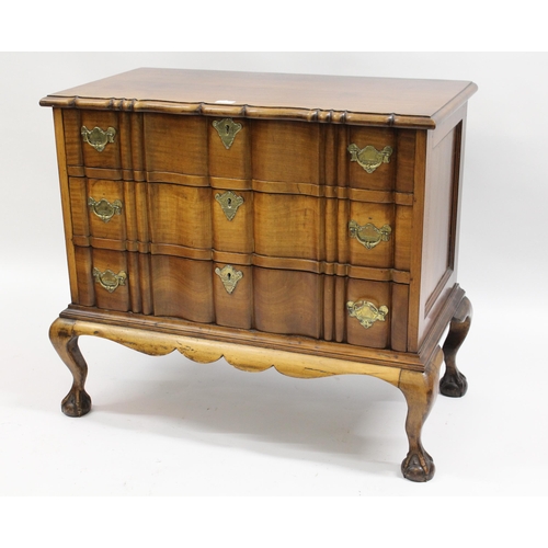 1931 - Continental block front chest of three shaped drawers above shaped frieze, on cabriole claw and ball... 