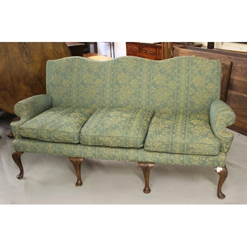 1932 - Green brocade upholstered triple humpback sofa in Georgian style, with shaped arms, raised on cabrio... 