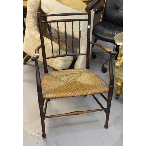 1966 - Arts and Crafts Sussex type ebonised side chair with rush seat, together with a 19th Century spindle... 