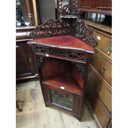 1975 - Small Art Nouveau mahogany corner cabinet, the pierced fretwork back above a fretwork frieze, alcove... 