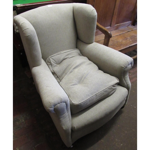 1977 - Early 20th Century armchair (recently upholstered), on bun supports with casters