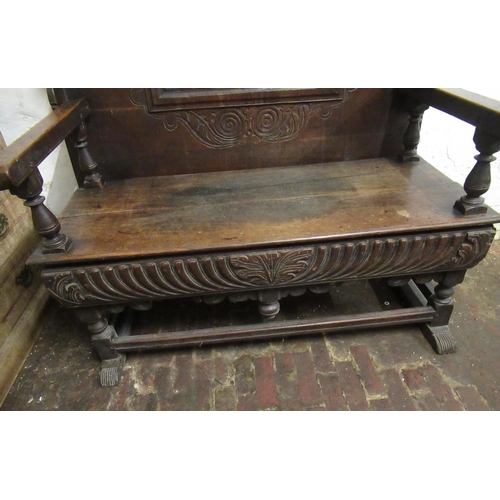 1991 - 19th Century Continental oak monks bench / table, the fold-over top on a panelled seat and carved fr... 