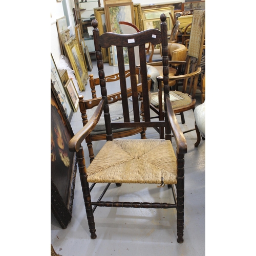 1994 - Arts & Crafts beechwood open arm chair with spindle back, together with various rush seated chairs, ... 