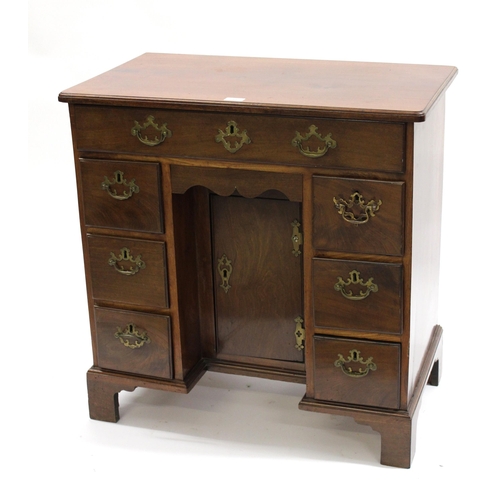 1997 - Small George III mahogany kneehole desk, the moulded top above seven drawers surrounding a central k... 