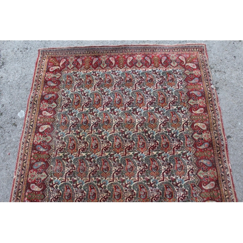 20 - Tabriz rug with all-over Boteh design on a cream ground with borders, 180 x 122cm (damages)