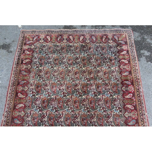 20 - Tabriz rug with all-over Boteh design on a cream ground with borders, 180 x 122cm (damages)