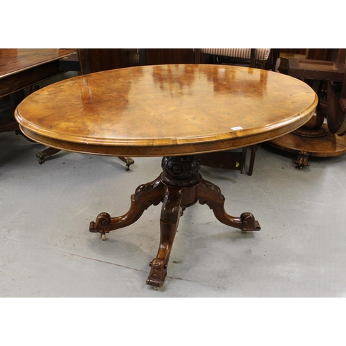 2000 - Victorian figured walnut oval pedestal centre table, the moulded top above a carved baluster column ... 