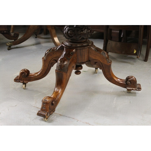 2000 - Victorian figured walnut oval pedestal centre table, the moulded top above a carved baluster column ... 