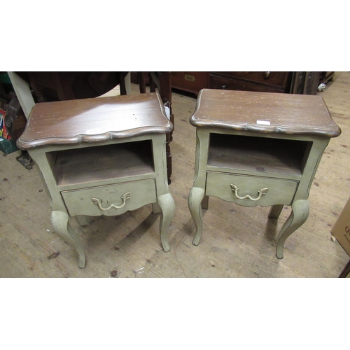 2015 - Pair of French green distressed painted bedside tables, with alcoves above drawers on cabriole suppo... 