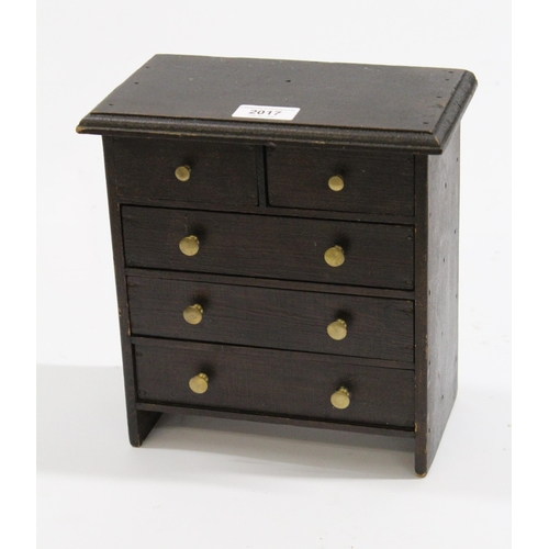 2017 - Miniature stained pine chest of two short over three long drawers with brass knob handles, 25cm high