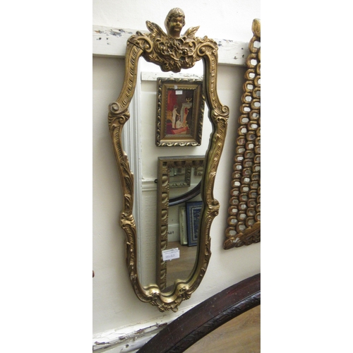 2021 - Small oval gilt framed bevelled edge wall mirror, small gilt framed cartouche shaped wall mirror, an... 