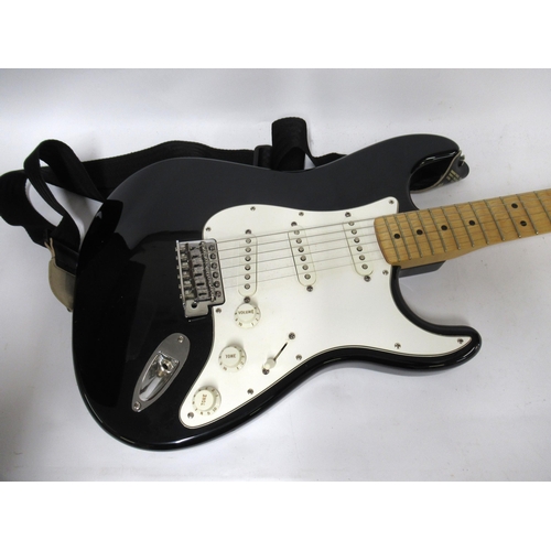 261 - Fender (made in Mexico) Stratocaster with maple neck and fingerboard on a black body with white scra... 