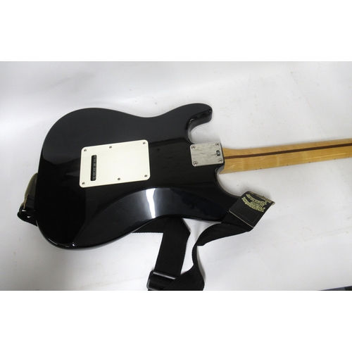 261 - Fender (made in Mexico) Stratocaster with maple neck and fingerboard on a black body with white scra... 