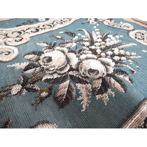 29 - Needlepoint and beadwork panel, stylised floral design of shield form on a blue ground, 45 x 39cm ap... 