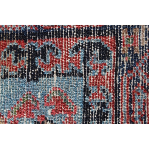 3 - Hamadan rug with an all-over stylised design on a pink ground with pale blue corner designs and bord... 