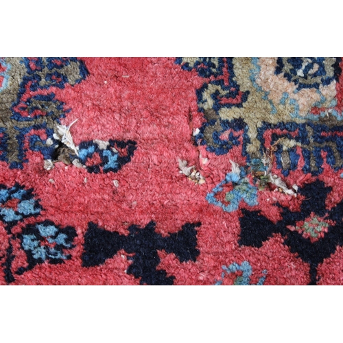 3 - Hamadan rug with an all-over stylised design on a pink ground with pale blue corner designs and bord... 