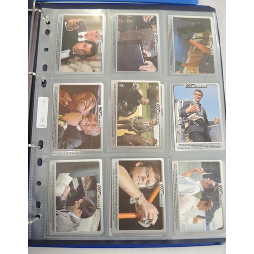 317 - Eight albums of trading cards, including Merlin battle cards, Daily Mirror cards, Cardz etc