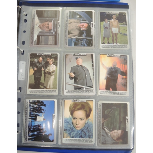 317 - Eight albums of trading cards, including Merlin battle cards, Daily Mirror cards, Cardz etc