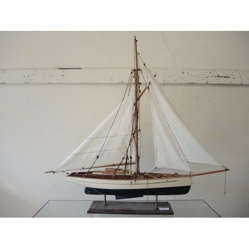 338 - Two wooden pond yachts with masts, together with a wooden model of a three masted galleon, the large... 