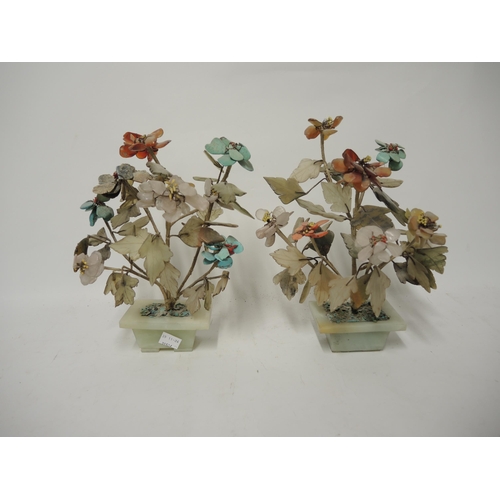 360 - Pair of Chinese soapstone flower ornaments on onyx bases, 25cm high