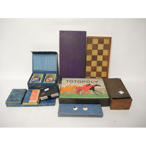 378 - Chess set with folding chess board, new game of Totopoly, and four cases of various playing cards