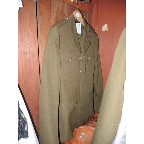 383 - Quantity of military uniforms including khaki (ladies and gentlemen's), an R.A.F. uniform and an off... 