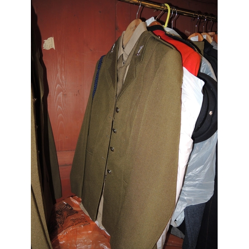 383 - Quantity of military uniforms including khaki (ladies and gentlemen's), an R.A.F. uniform and an off... 