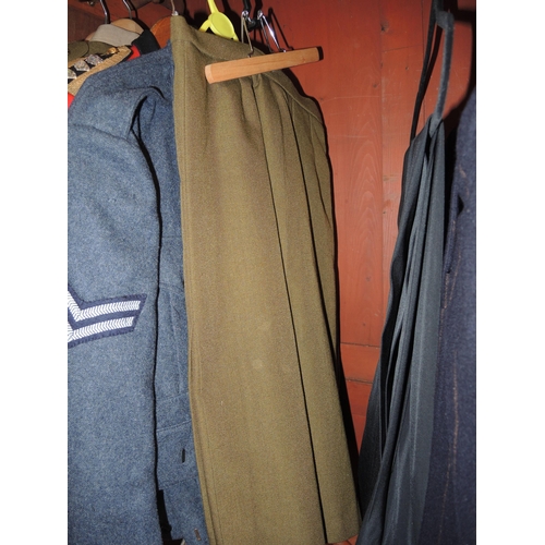 383 - Quantity of military uniforms including khaki (ladies and gentlemen's), an R.A.F. uniform and an off... 