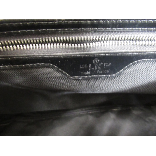 42 - Louis Vitton black leather holdall and wash bag