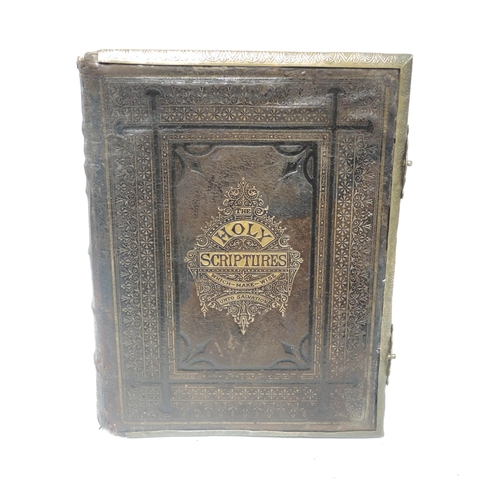 421 - Box containing a collection of various items, including crucifix, leather Bible, pair of brass candl... 