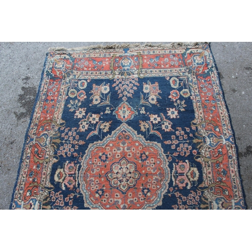 5 - Tabriz rug with a medallion and all-over floral design on a midnight blue ground with vase design bo... 